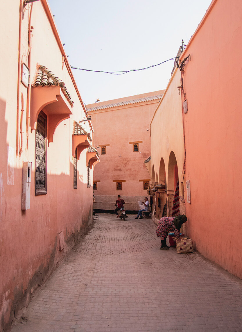 The medina in Marrakech is surrounded by terracotta-red walls and features both wide alleys and incredibly narrow passageways.