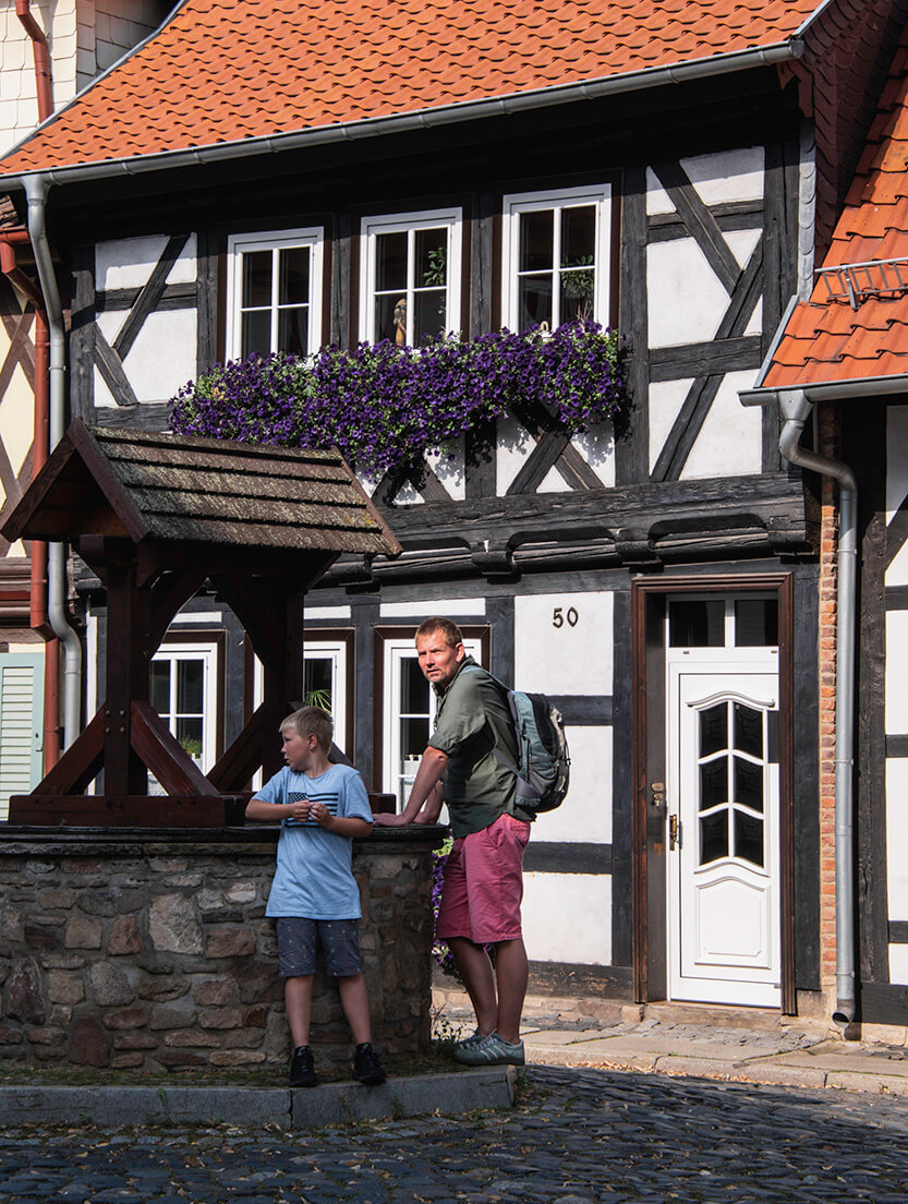 Peter and Sebastian waiting for me by the well in Wernigerode.