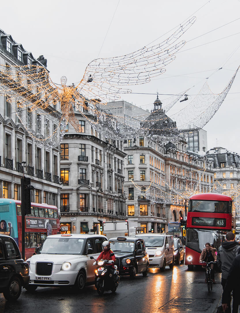 Christmas suits London – wrapped in glitter, as the red double-decker buses glide around the corner and splash rainwater onto you…