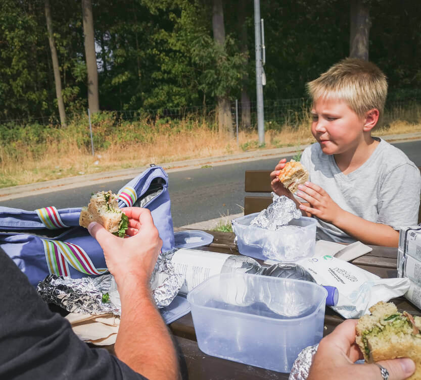 We eat our packed lunch on our road trip.