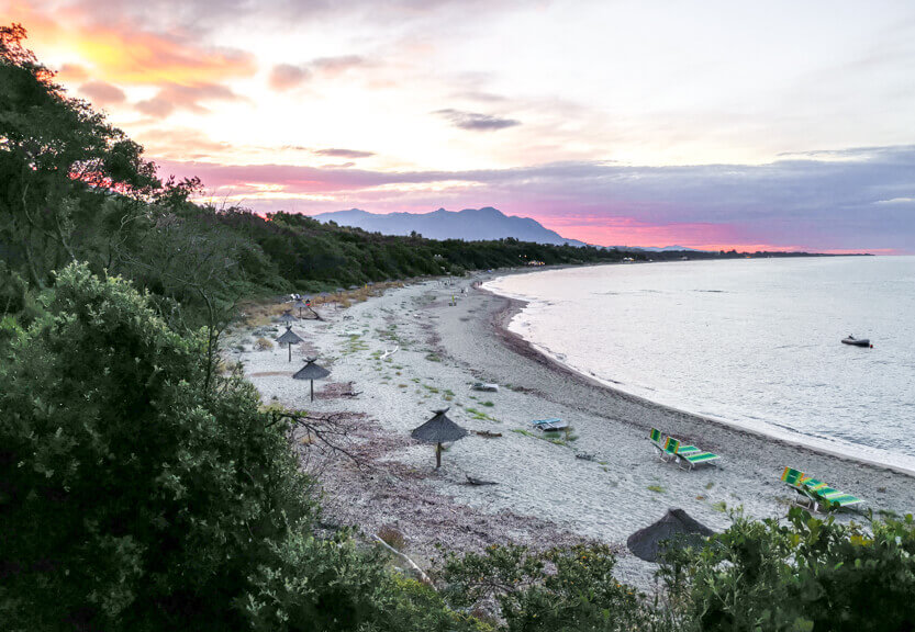 The sun is setting on the beach at Bagheera, and the beach is almost empty.