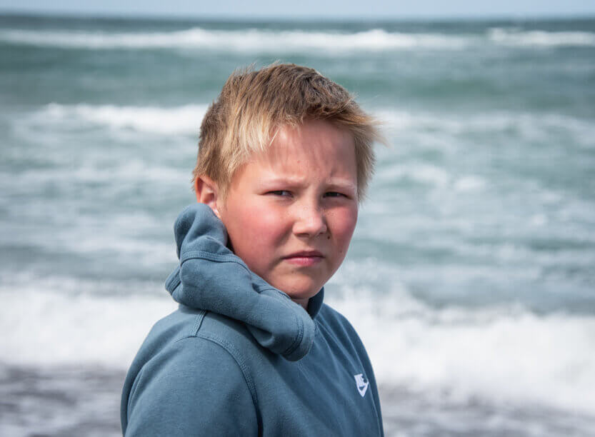 Sebastian at the beach below Svinkløv Badehotel.