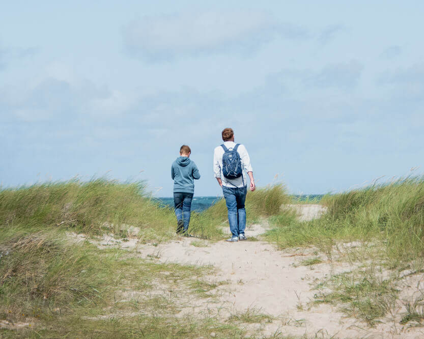 Peter and Sebastian on their way to the beach below Svinkløv Badehotel.